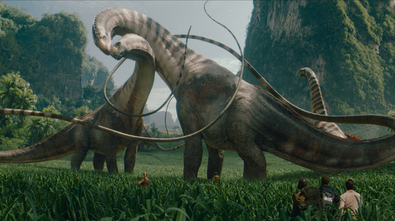 A herd of Titanosaurus graze in a valley in Jurassic World Rebirth