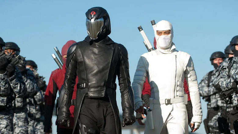Luke Bracey as Cobra Commander walks between his troops with Lee Byung-hun as Storm Shadow in G.I. Joe Retaliation