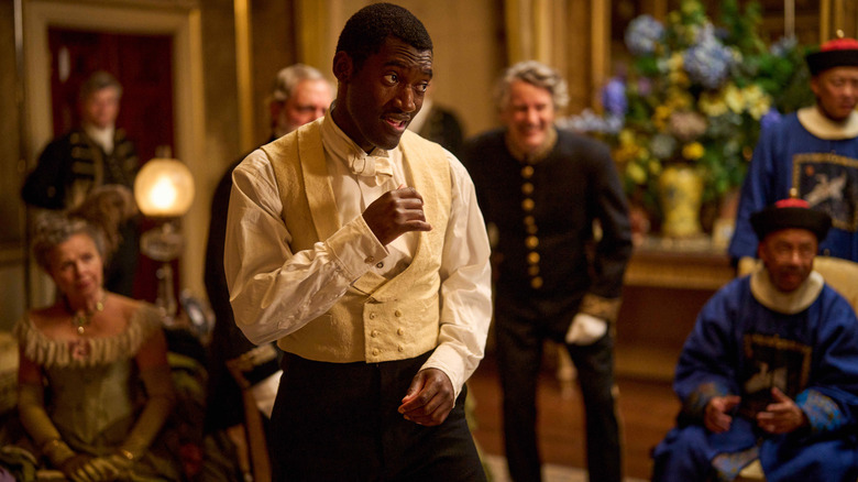 Malachi Kirby as boxer Hezekiah Moscow squaring up for a fight in front of wealthy onlookers in A Thousand Blows