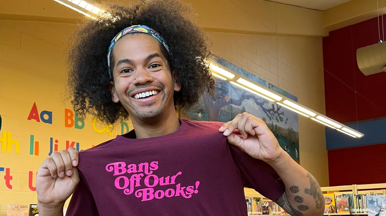 Mychal the Librarian showing off his merchandise