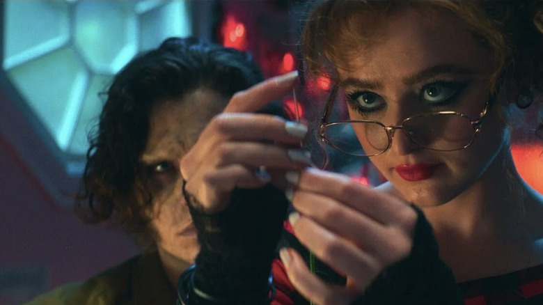Lisa testing a sewing needle in Lisa Frankenstein