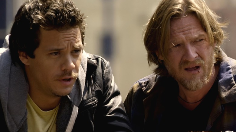 Hank and Britt look flabbergasted while talking to each other in Terriers