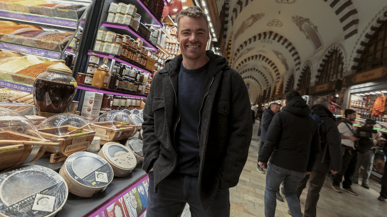 Behind-the-scenes still of Gabriel Basso as Peter Sutherland in The Night Agent season 3