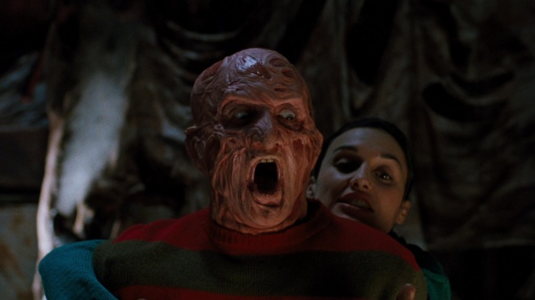 Katherine hugging Freddy from behind in "Freddy's Dead: The Final Nightmare"