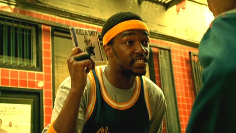 Anthony Mackie's K-Luv holding up a CD in Spike Lee's Sucker Free City.