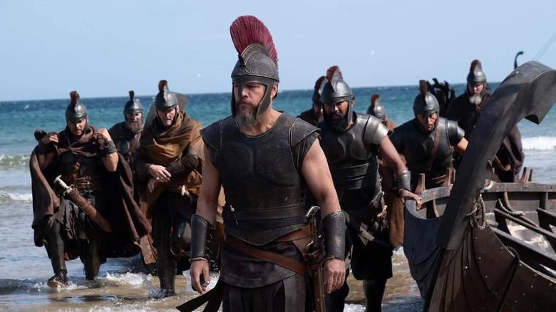 Odysseus leading his men on to the shores of a beach in The Odyssey (2026)