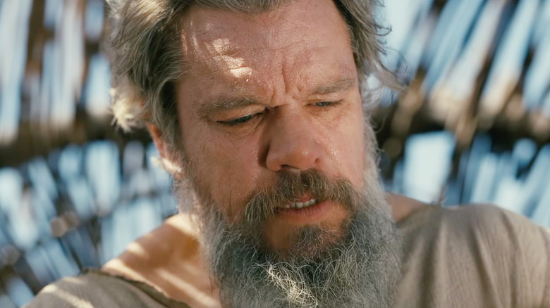 Matt Damon as Odysseus standing by his men at their boats in The Odyssey