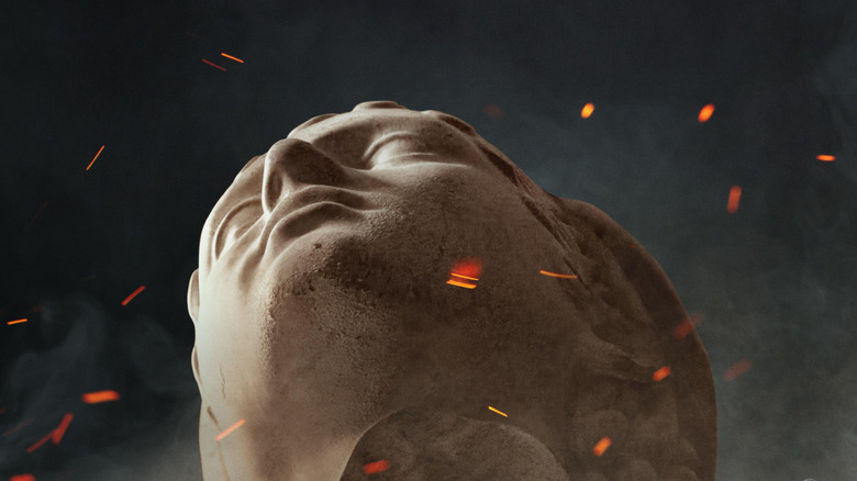 The statue with hot ash floating around its head on the poster for Christopher Nolan's The Odyssey (2026)