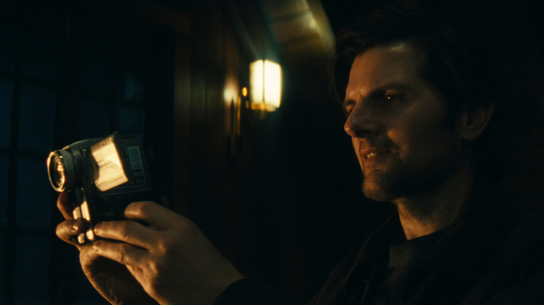 Mark looking into the camcorder on Severance