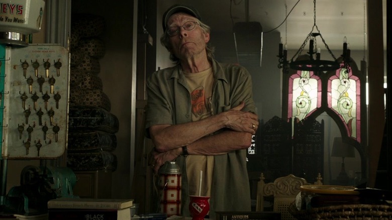 Stephen King as the shopkeeper standing up in It Chapter Two