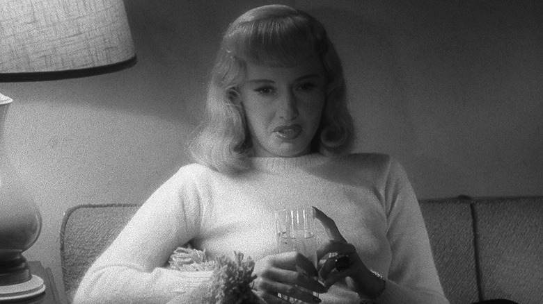 Barbara Stanwyck holds a glass in Double Indemnity