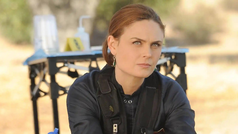Emily Deschanel as Temperance Brennan sitting outside on a chair in Bones