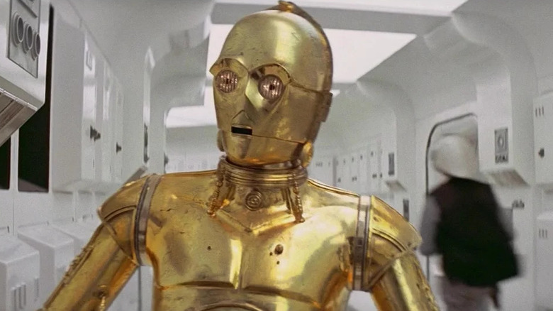 C-3PO walks down the hallway in Star Wars: A New HOpe
