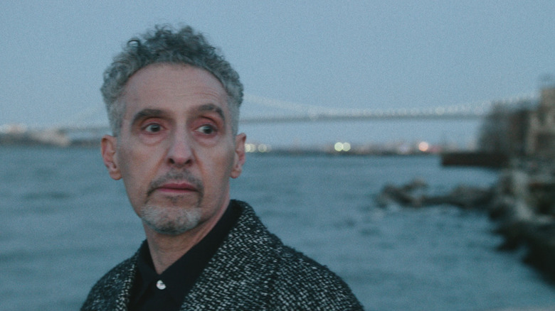 Harry looking melancholy on the shore in The Only Living Pickpocket in New York
