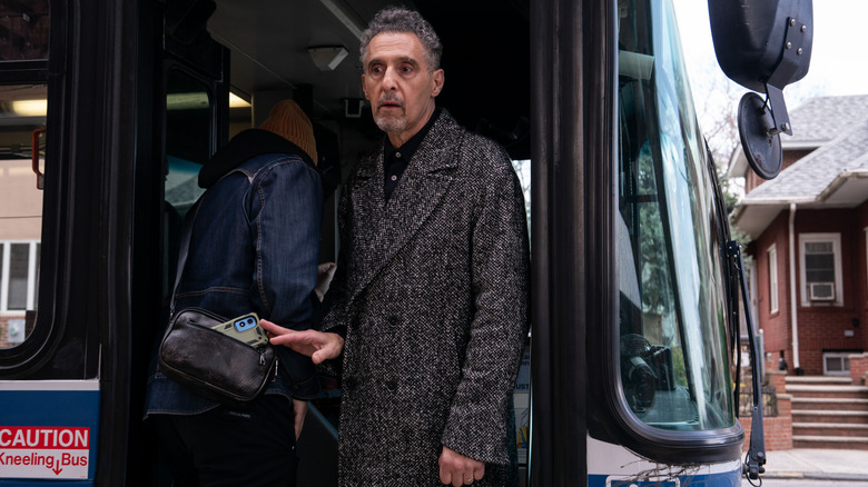 Harry stealing a phone on a bus in The Only Living Pickpocket in New York