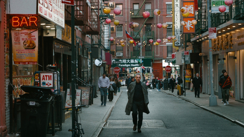 Harry walking through Chinatown in The Only Living Pickpocket in New York