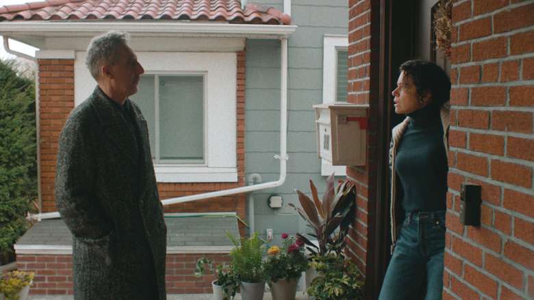 Harry and his daughter stand on her suburban porch in The Only Living Pickpocket in New York