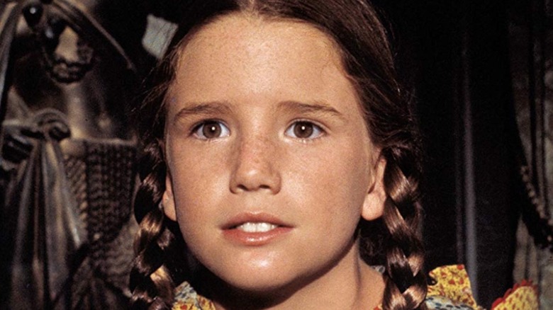 Melissa Gilbert as Laura Ingalls looking thoughtful on Little House on the Prairie