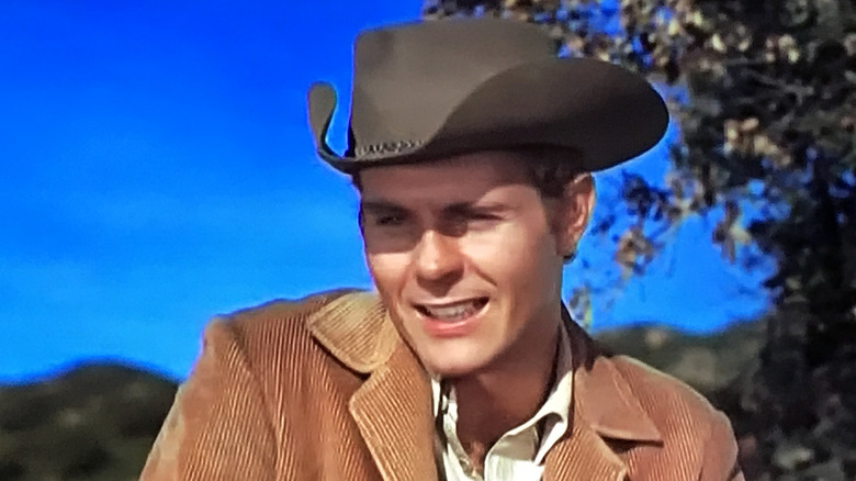 Stacey Grainger (Don Quine) sitting on a horse on The Virginian