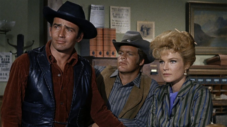 James Drury as The Virginian, Doug McClure as Trampas, and Pippa Scott as Molly Wood in the sheriff station in The Virginian
