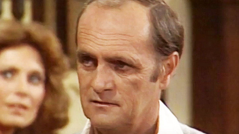 Bob Newhart's Dick Loudon is seen in closeup in Newhart