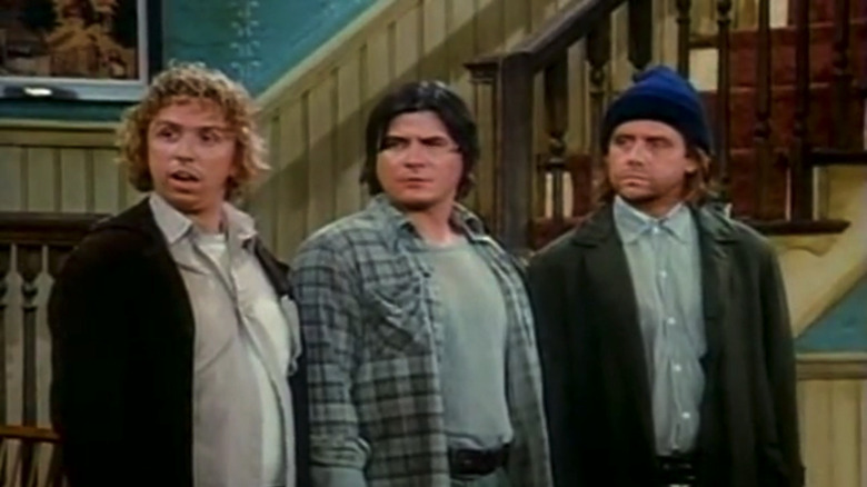 John Voldstad's Darryl stands next to Tony Papenfuss' Darryl and William Sanderson's Larry as they look to their right in Newhart