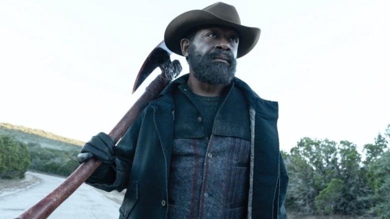 Lenny James as Morgan Jones with a cowboy hat and an ax on Fear the Walking Dead