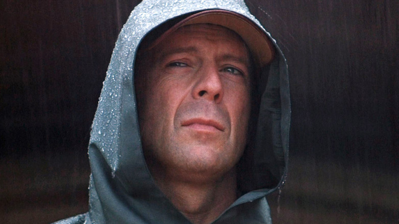 Bruce Willis in the rain in Unbreakable