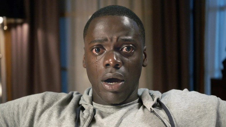 Chris crying while hypnotized in a chair in "Get Out"
