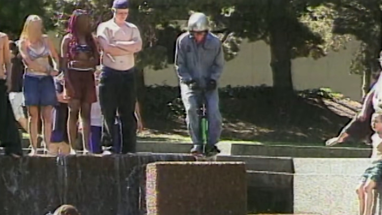 Danger Ehren jumping on a pogo stick down a fountain in Jackass