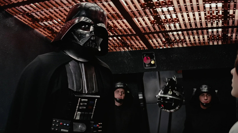 Darth Vader standing in a cell next to an interrogation droid in Star Wars: A New Hope