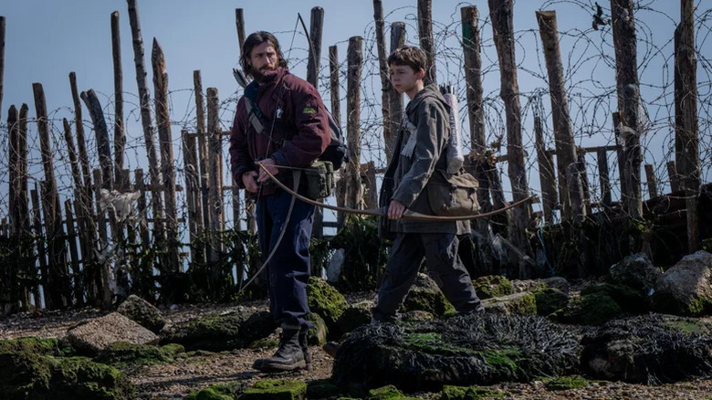 Jimmy and Spike are walking through the barbed wire fence after 28 years