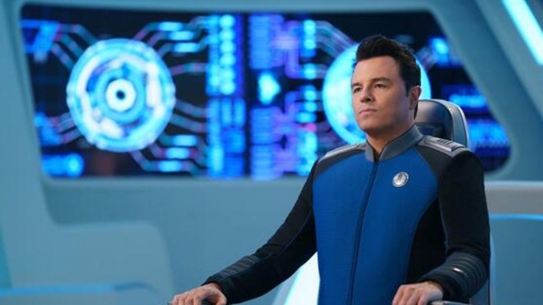 Seth MacFarlane's Captain Ed Mercer sitting on the captain's chair on The Orville: New Horizons