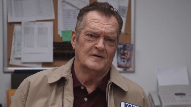 Bob Vance sitting at a desk on The Paper