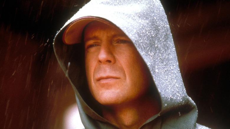 Bruce Willis standing in the rain in Unbreakable