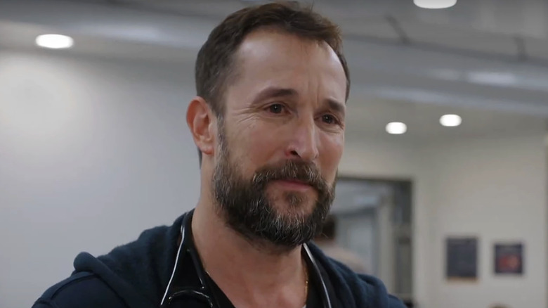Noah Wyle's  Dr. Michael Robinavitch looks across frame in The Pitt