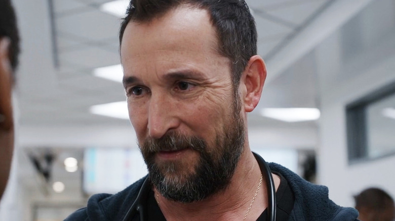 Noah Wyle as Dr Michael Robinavitch looks at someone off-screen in The Pitt