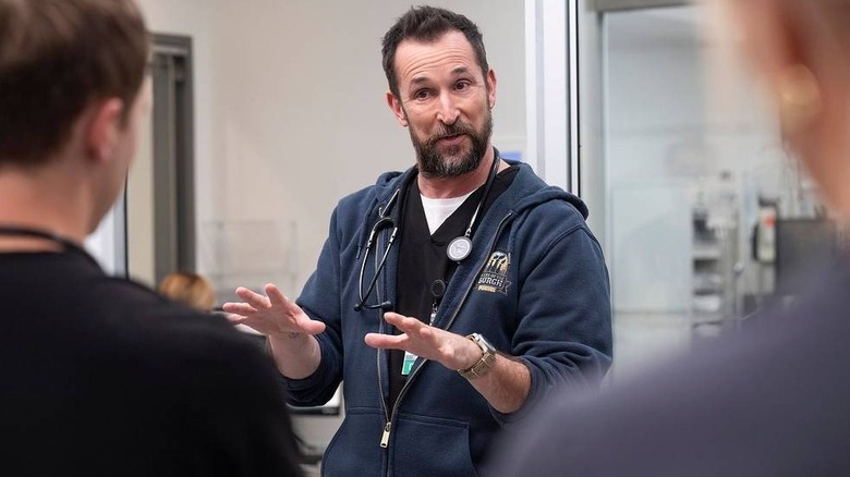 Robby talking to colleagues on The Pitt