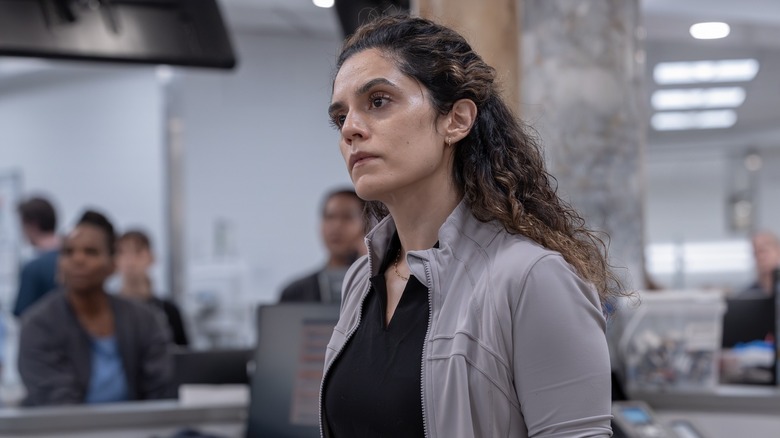 Dr. Al-Hashimi with her head tilted looking at someone on The Pitt