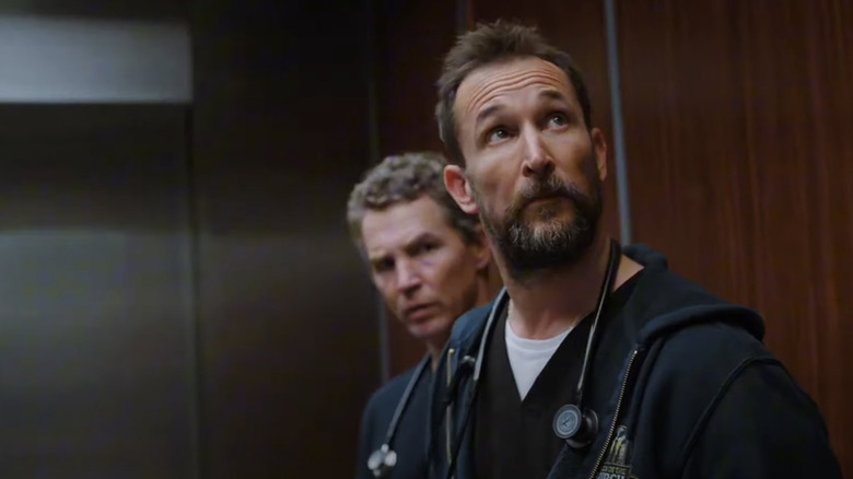 Noah Wyle's Dr Michael Robonavitch stands in front of Sean Hatosy's Dr Jack Abbott in The Pitt