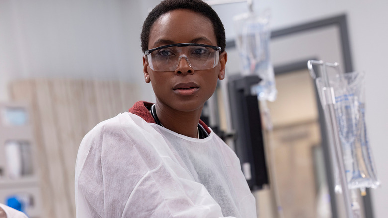 Tracy Ifeachor as Dr. Collins wearing goggles in The Pitt