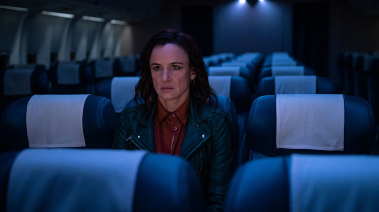 Juliette Lewis as Natalie Scatorccio sitting in an empty airplane in Yellowjackets
