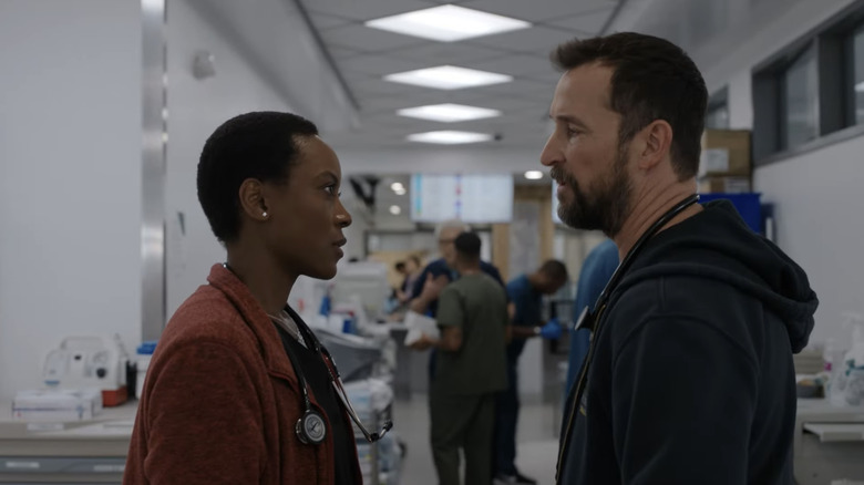 Tracy Ifeachor's Dr. Heather Collins stands across from Noah Wyle's Dr. Michael Robinavitch in the ER at The Pitt