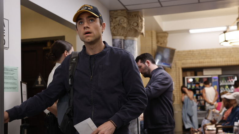 Dr. Frank Langdon in a Steelers hat returning to work on The Pitt