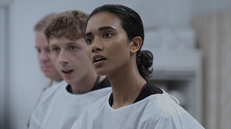 Samira with Whitaker behind her looking concerned on The Pitt