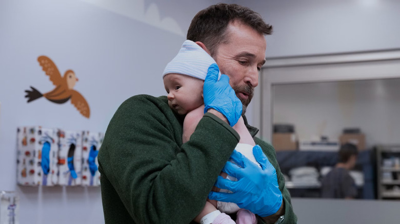 Dr. Robby holding Baby Jane Doe in The Pitt Season 2