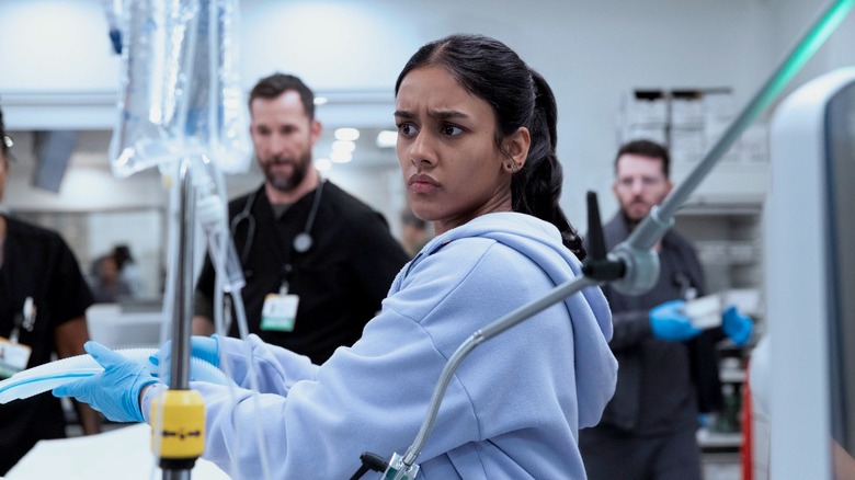 Javadi looking concerned in the ER on The Pitt