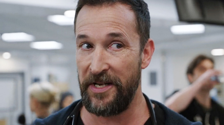 Noah Wyle's Dr Michael Robinavitch looks off to the side in The Pitt