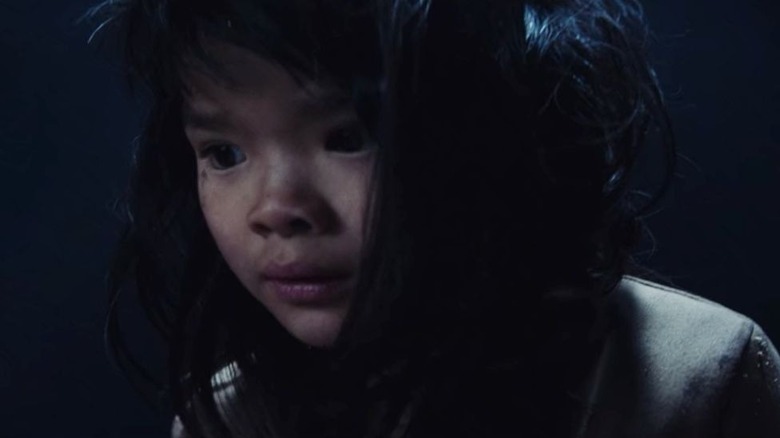 The little girl looking down