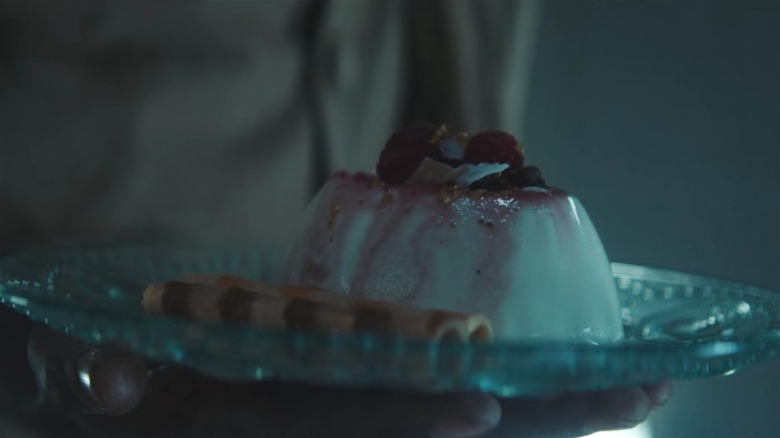 Baharat holding the panna cotta